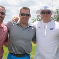 4 alumni men play golf